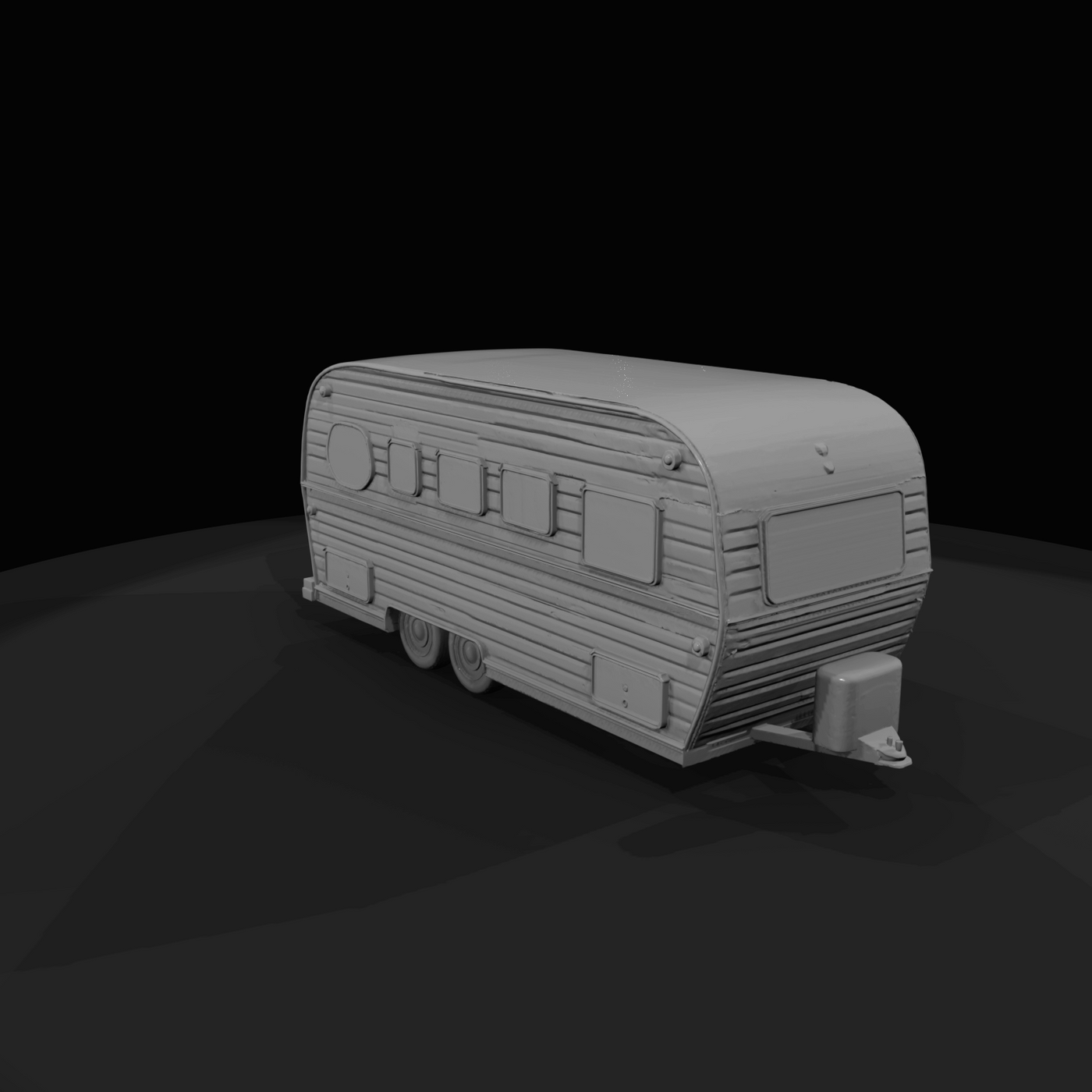 mid-size retro travel trailer with corrugated metal siding, rounded roof and front hitch assembly