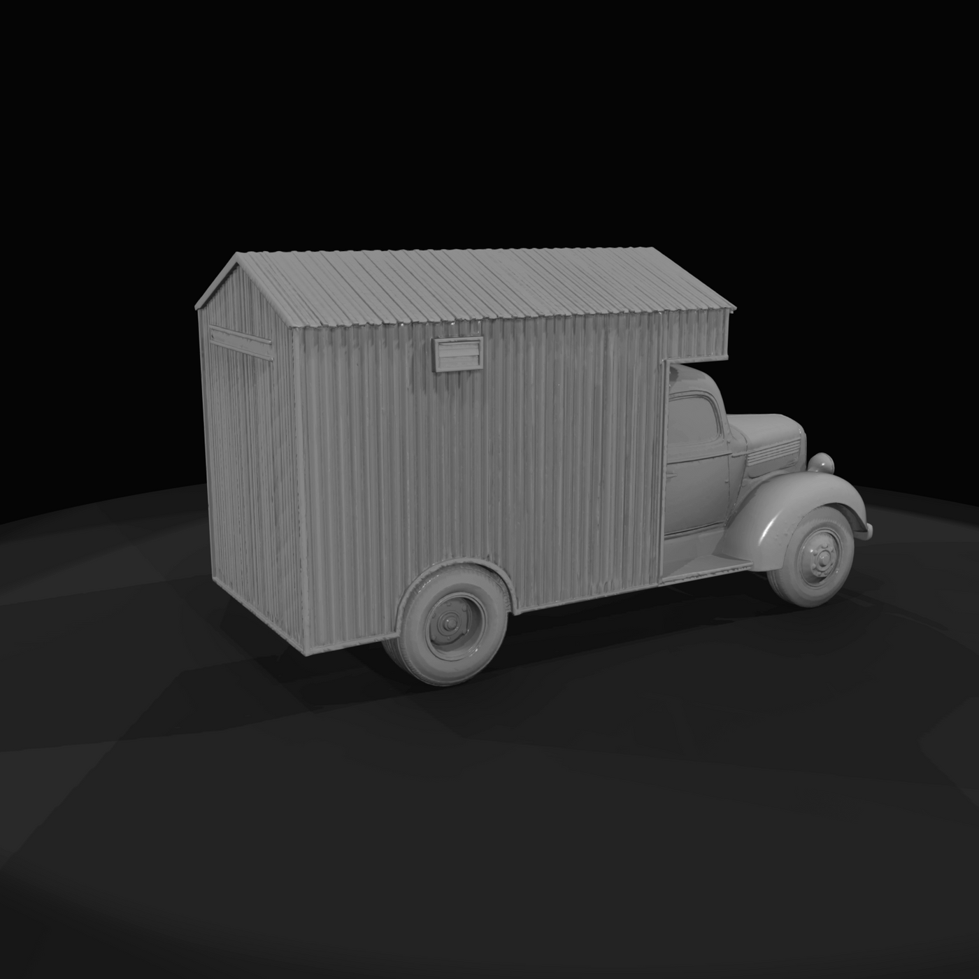 Period light-duty truck chassis with a corrugated metal or wooden mobile-cabin body mounted on the bed