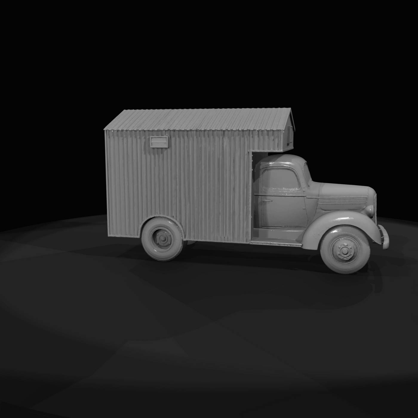 Period light-duty truck chassis with a corrugated metal or wooden mobile-cabin body mounted on the bed