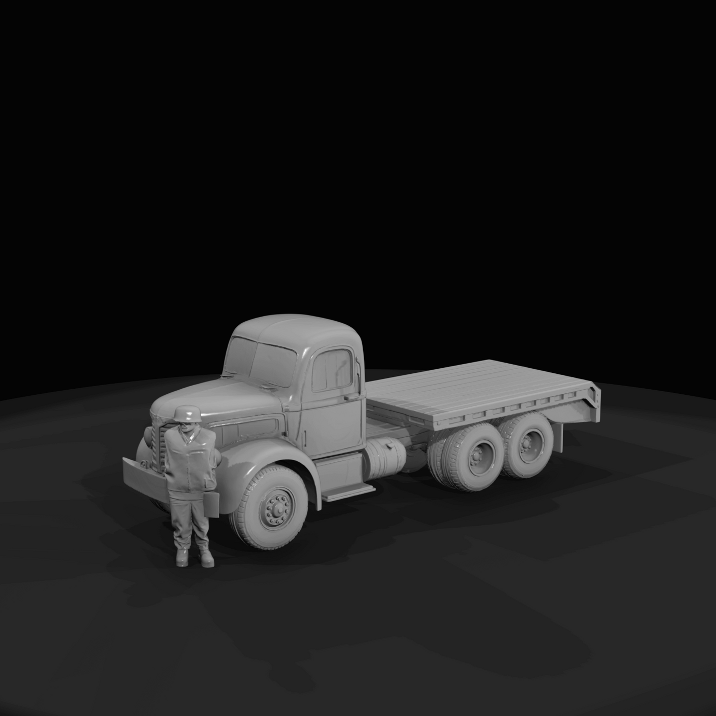 yellow heavy-duty tractor and lowboy trailer (logging/low-loader style)