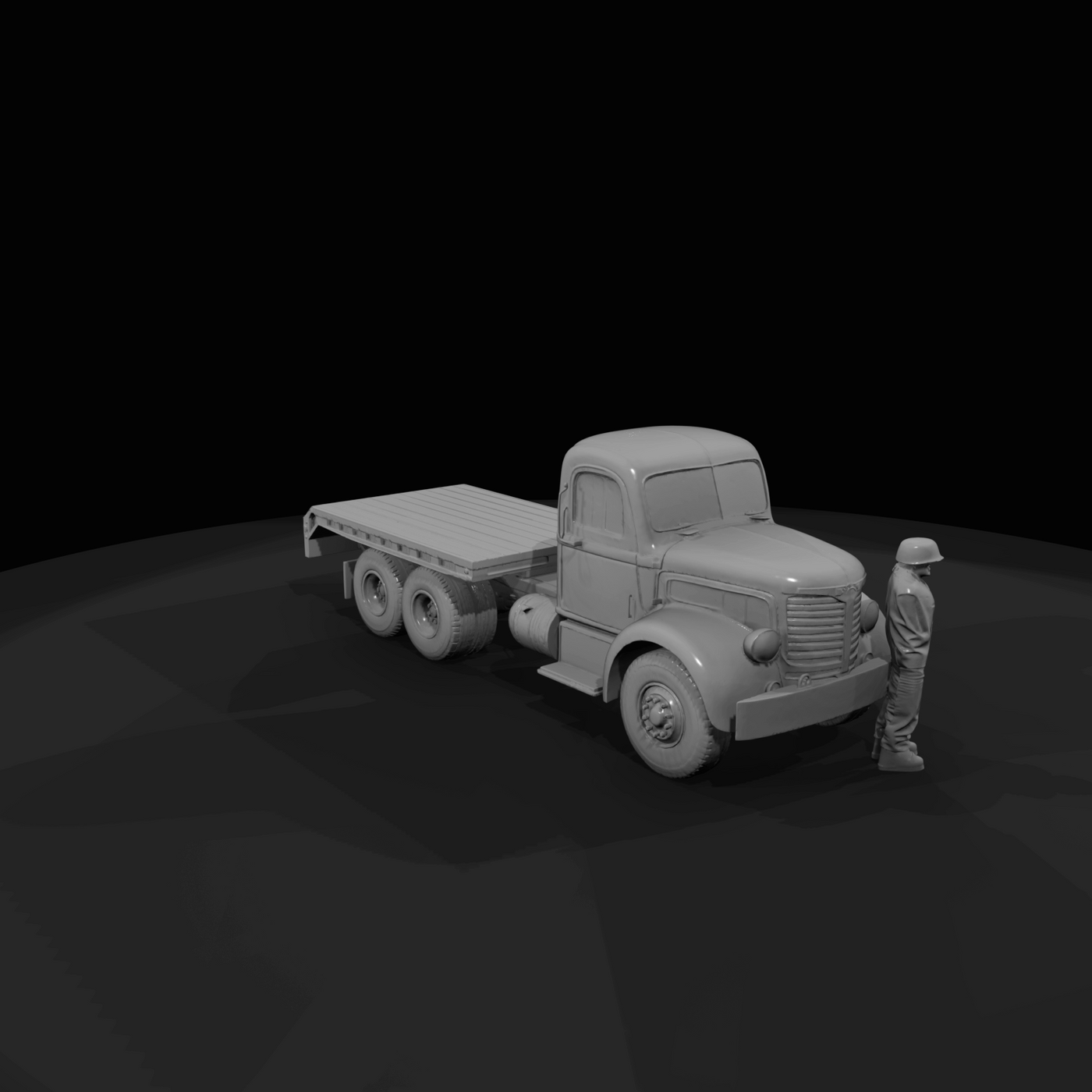 yellow heavy-duty tractor and lowboy trailer (logging/low-loader style)