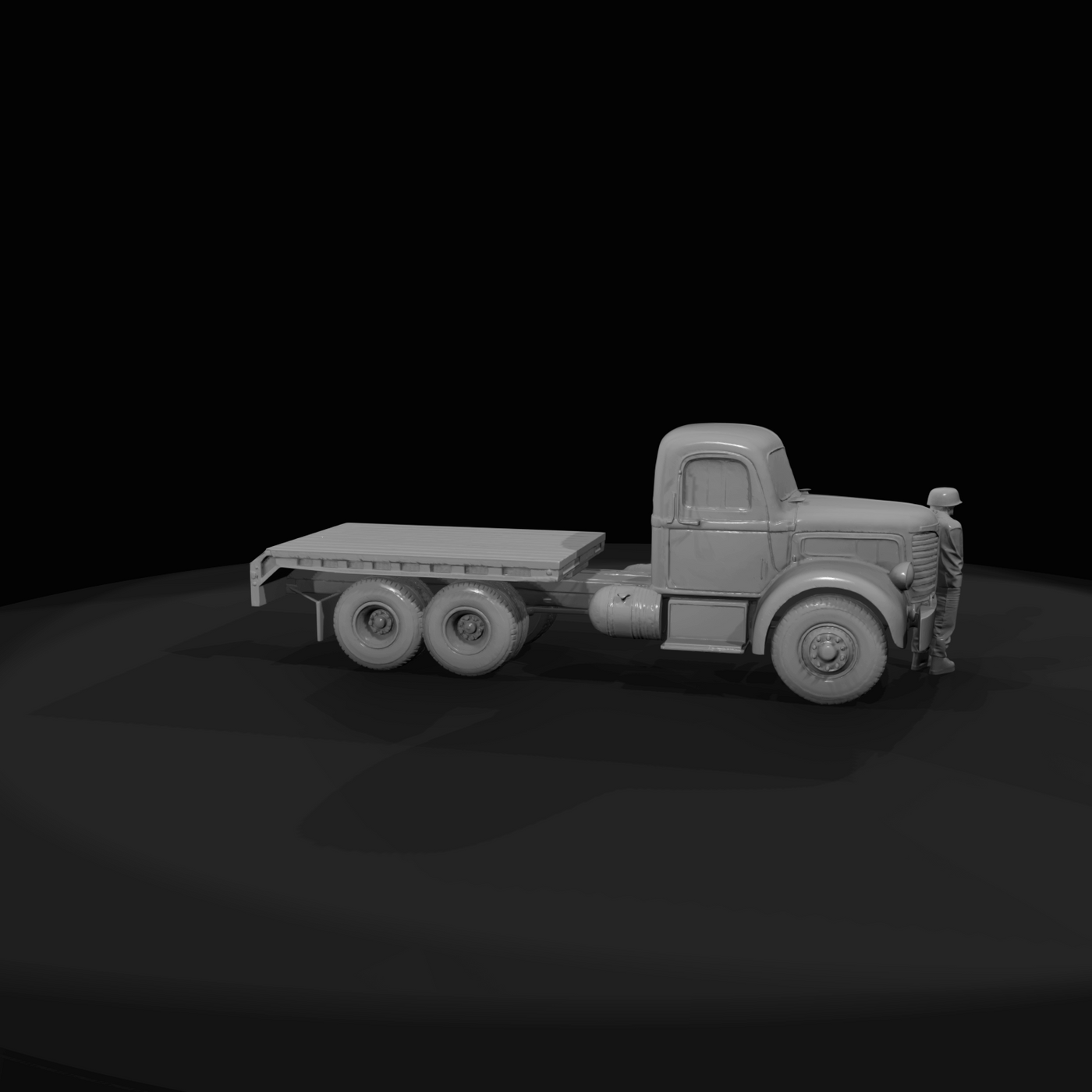 yellow heavy-duty tractor and lowboy trailer (logging/low-loader style)