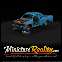 Stripped Blue Pickup on Jack Stands — thumbnail 2