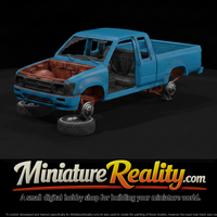 Stripped Blue Pickup on Jack Stands — thumbnail 3