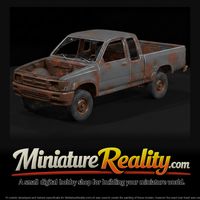 Stripped Blue Pickup on Jack Stands — thumbnail 1