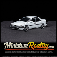 Generic Four-Door Sedan — Car miniature, three-quarter view — thumbnail 2