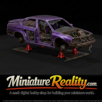 Stripped Sedan Shell on Jack Stands — thumbnail 1