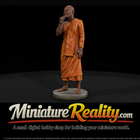 Buddhist Monk Speaking at a Microphone — thumbnail 1