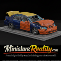Crushed Sedan Wreck on Roadway Base — thumbnail 1