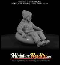 winter-skier-young-boy-on-snow-tube — thumbnail 2