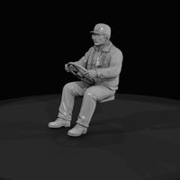 seated-male-driver-figurine — thumbnail 2