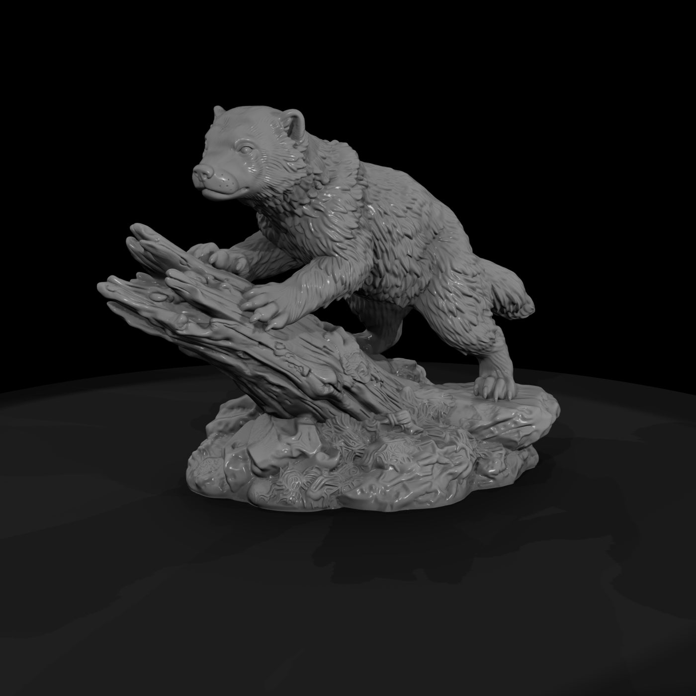 juvenile-wolverine-figurine-on-rock-wildlife-658058