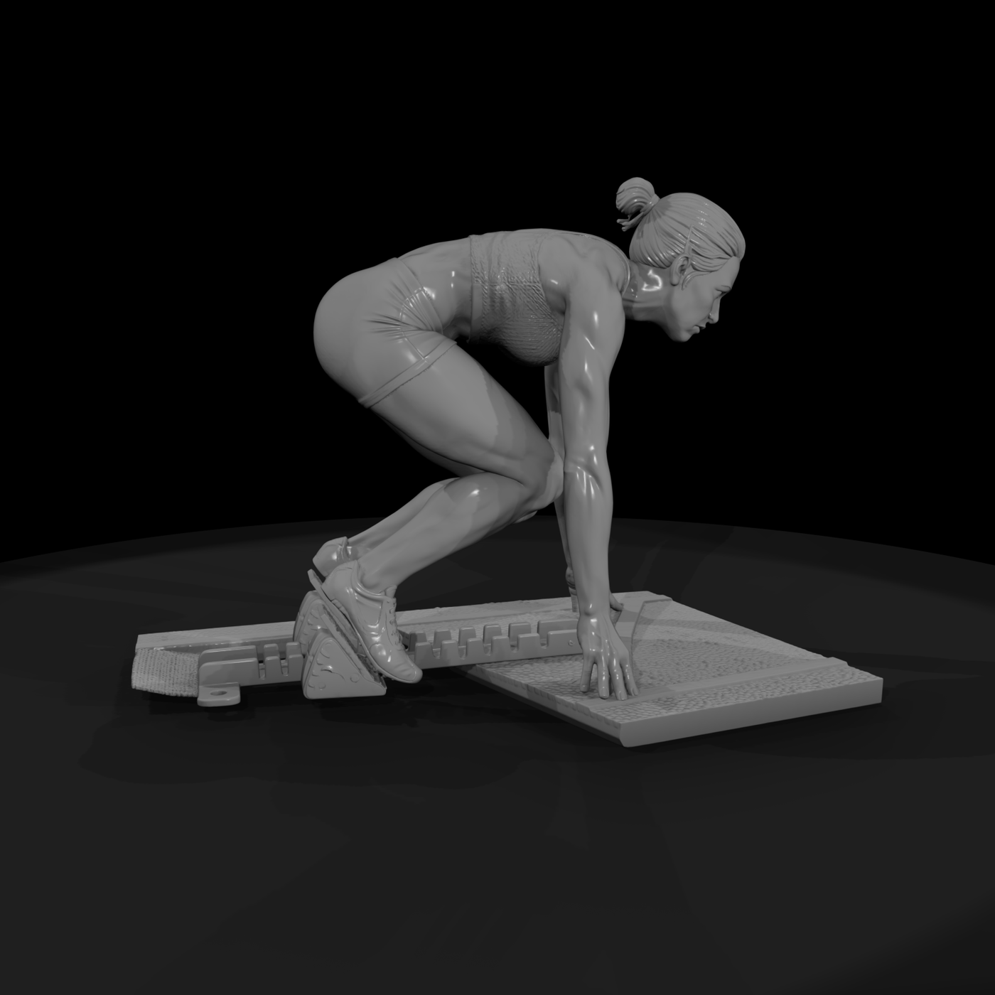Track Sprinter in Starting Blocks