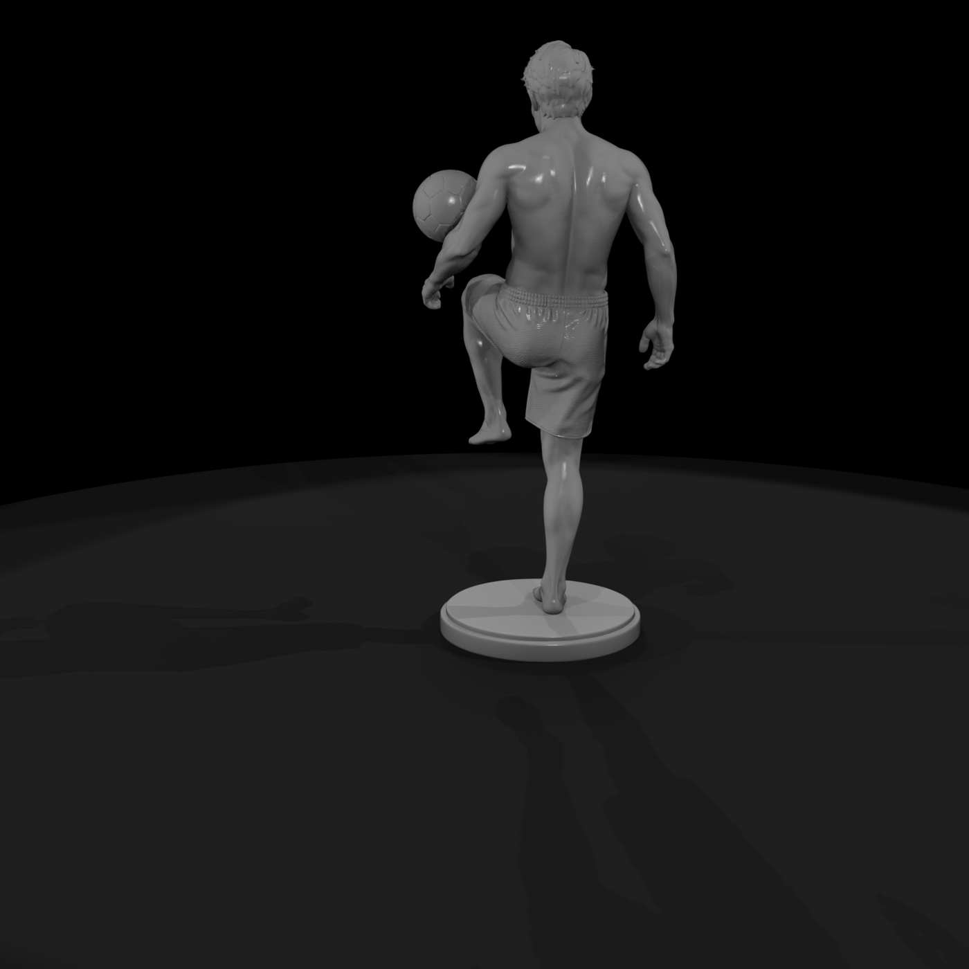 Beach Footballer Juggling a Ball